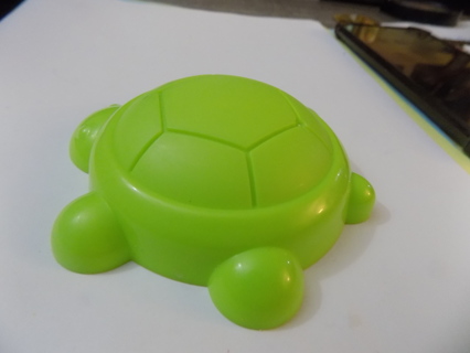 Green plastic turtle sand mold