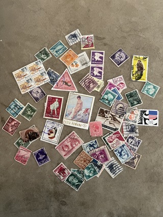WORLDWIDE POSTAGE STAMP COLLECTION Over 150 canceled stamps from around the world and the US