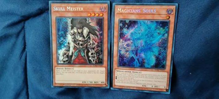 2 near mint condition Secret Rare Holo Yugioh Cards Skull Meister and Magician's Souls