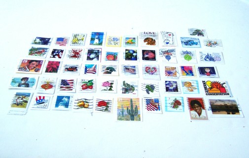 United States Postage Stamps Used set of 51 still on paper