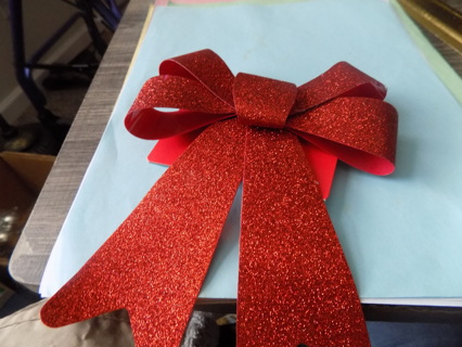 5 1/2 inch wide red glittery metallic bow for a package