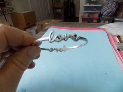 Bracelet silvertone bangle spells out L O V E in cursive and on 2 sides # 1