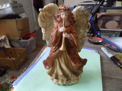 2000   9 inch resin angel blowing a horn wears peach color gown