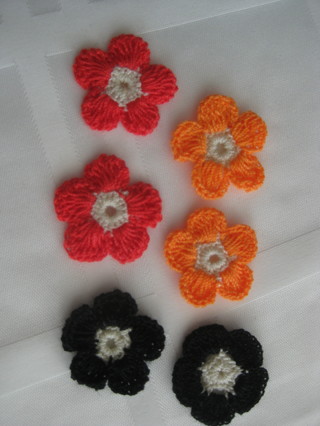 Hand crochet flowers, red, orange and black, 6 flowers total. New, never used