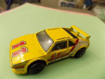 Matchbox # 11 race car with red and whie stripes, back spoiler
