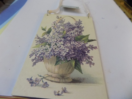 5 1/2 x 3 1/2 NEW with tag basket of purple flowers on white ribbon hanger
