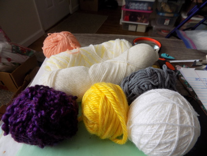 7 different skeins of yarn or balls 