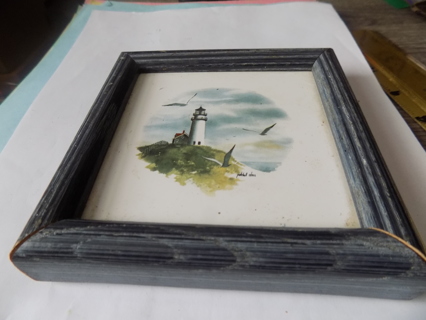 5 inch square blue wood fram has lighthouse, sea gulls under glass Hang up or easel backed