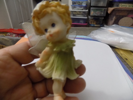 3 1/2 inch tall fairy baby wears green flower hat,& dress, netted wings