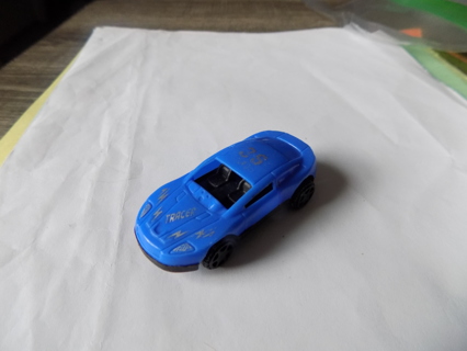 Blue plastic tracer race car 35 on roof about 2 1/2 inch long