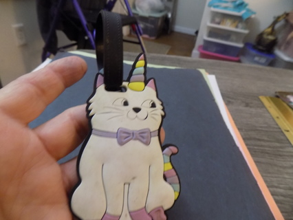 Rubber white cat in unicorn horn and rainbow tail luggage tag 4 1/2 tall 