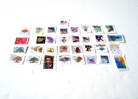 United States Postage Stamps set of 33 still on paper