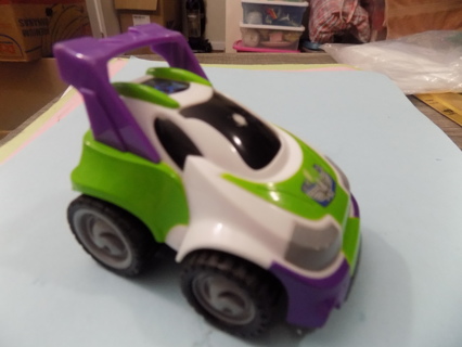 Disney's Buzz Lightyear push car green & purple & white with rear high fin