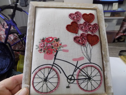 Wooden frame shadowbox has bicycle with seed bead wheels basket flowers trim in jewel  heart fabri