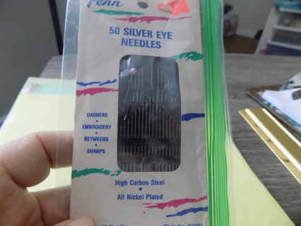 Pack of silver eye needles and 2 has pearl heads