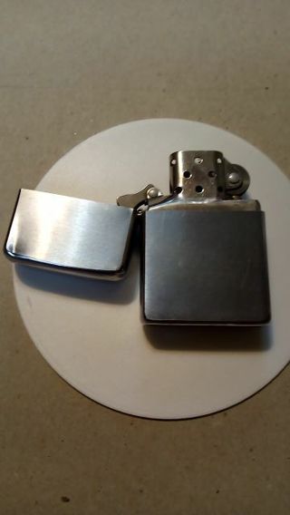 ZIPPO WINDPROOF LIGHTER... A FEW DINGS BUT WORKING GREAT...RELIST DUE TO NON PAYMENT