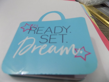 Blue purse shaped notepad says Ready, set, dream