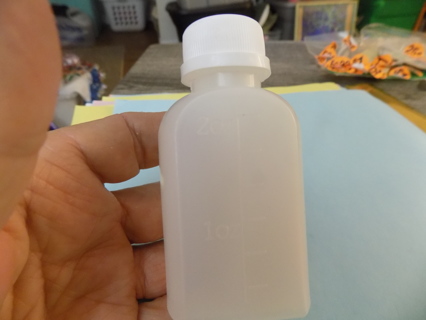 plastic flat side 2 oz bottle refillable with twist off lid