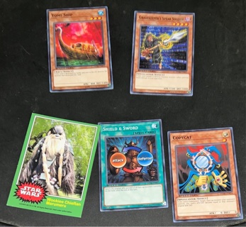 4 yugioh and 1 Star Wars trading cards 