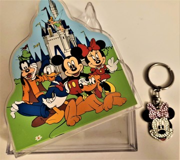 Small (6" x 4 1/2" x 1 1/2") plastic Disney castle-shaped box with Minnie Mouse keychain