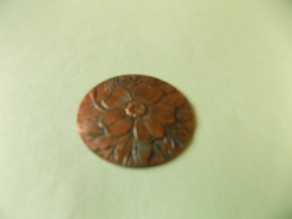 2 inch round bronze medallion with embosed dogwood flower embellishment