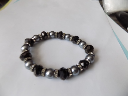 Bracelet black faceted beads, round silvertone beads, rhinestone spacers on stretchy cord