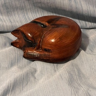 Wood sleeping cat