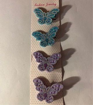 4 SPARKLY BUTTERFLY BARRETTS. 