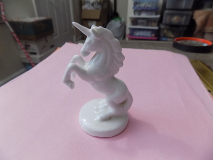 3 inch tall ceramic all white unicorn on his hind legs