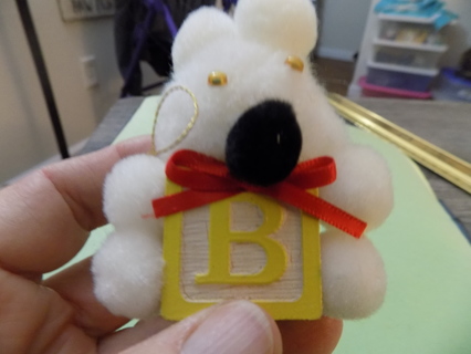 Pom pom bear ornament on wooden yellow block with letter B