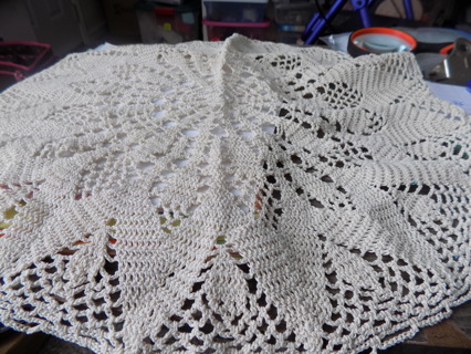 18 inch round tan crocheted table doily flower pattern center