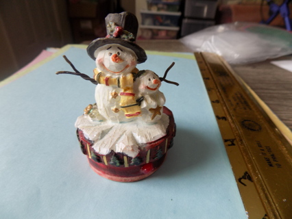 3 1/2 inch resin snowman with twig arms and a snowman child