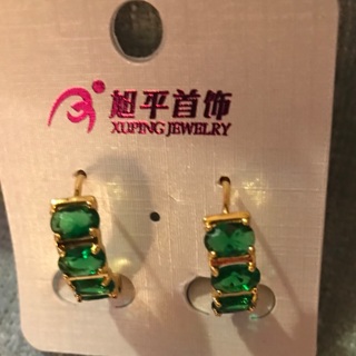 Golden earrings with green stones
