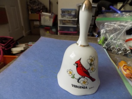 5 1/2 inch tall ceramic Virginia bell with cardinal and Dogwood tree