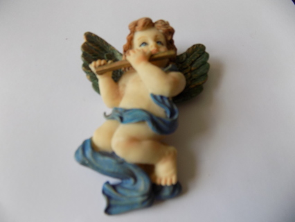 Vintage 3 1/2 inch resin angel cherub playing flute green wings, blue sash