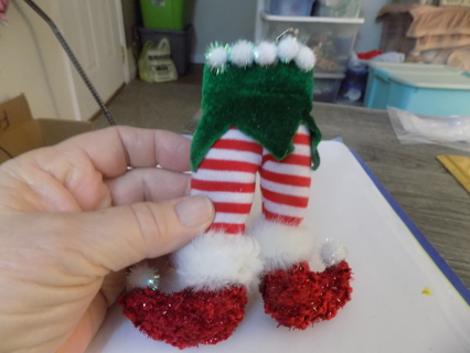 Pair of fabric elf legs striped with elf shoes on ornament