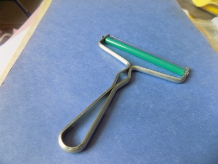 Vintage aluminum cheese slicer with green roller