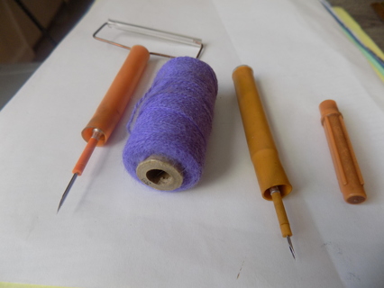 Set of 2 needle punch yarn craft needles and a roll of light purple punch yarn