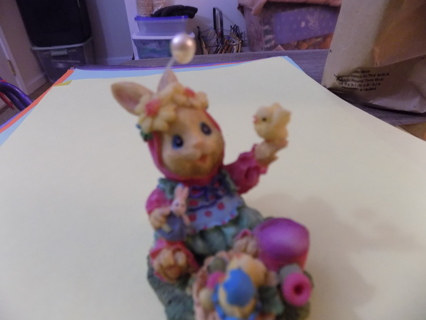 2 1/2 inch resin bunny dressed as an angel with wings & pearls on head holds chick in hand
