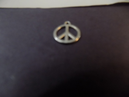 Silvertone peace charm inside a circle 1/2 inch