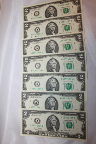 7- $2.00 UNCIRCULATED BILLS WITH SERIAL # IN SEQUENCE