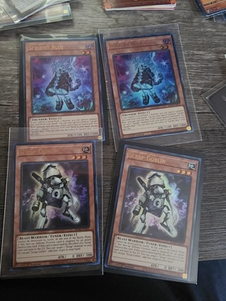 4 Holo Yu-Gi-Oh cards (2 Scrap Goblins and 2 Spright Blues)