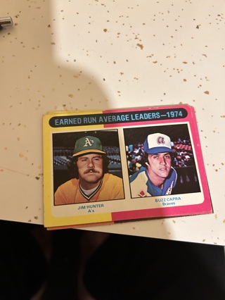 1975 topps 1974 era leaders jim hunter / buzz capra