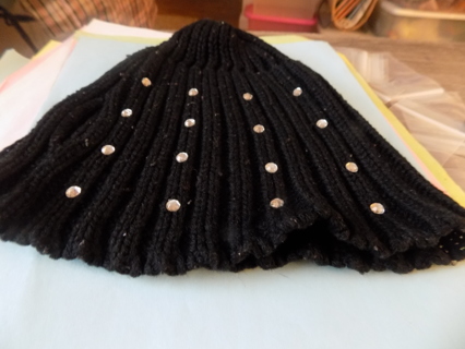 black knitted beanie hat covered in round clear rhinestones and ribbed