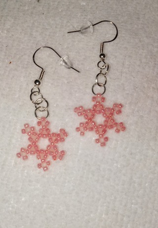 Handmade pink beaded snowflake earrings