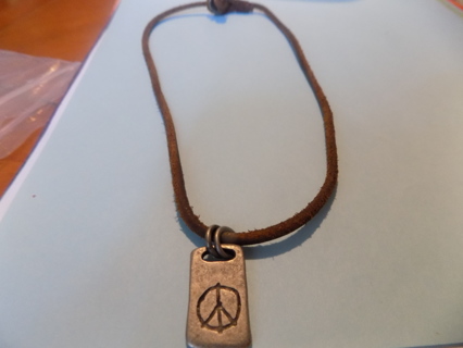 Hand made peace sign necklace metal charm, peace sign engraved, says Peace on back