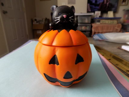 Ceramic 4 inch tall Jack-a-Lantern candle holder with black cat popping out