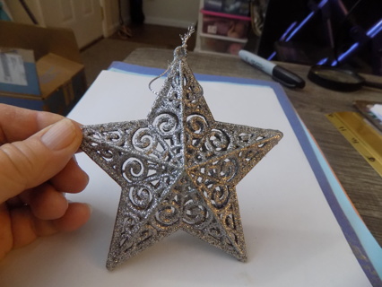 Plastic silver filigreen star ornament 4 1/2 wide
