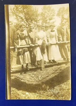 Early Photo standing on a bridge