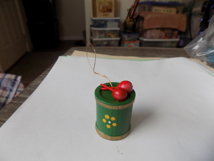 2 12 inch wood green drum ornament with 2 red drumsticks and yellow dot flowers